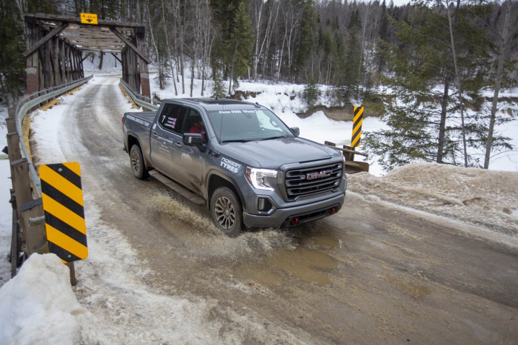 gmc pickup front three-quarter action at alcan 5000 winter rally