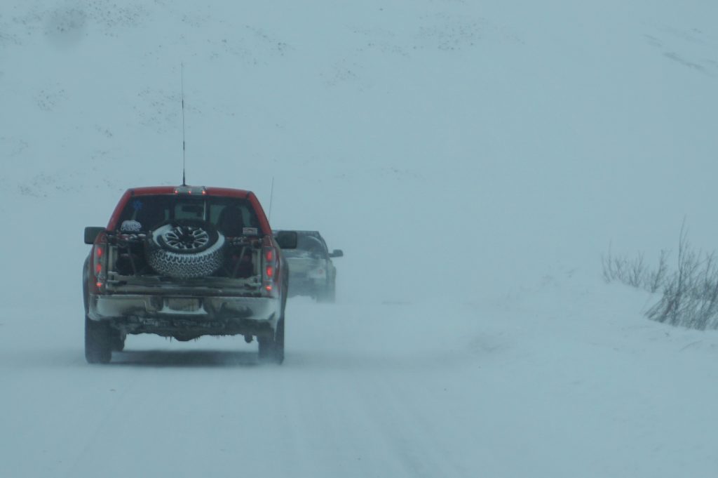 truck rear on road during alcan 5000 rally route