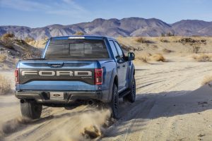 2019 Ford F-150 Raptor rear three-quarter sand road action