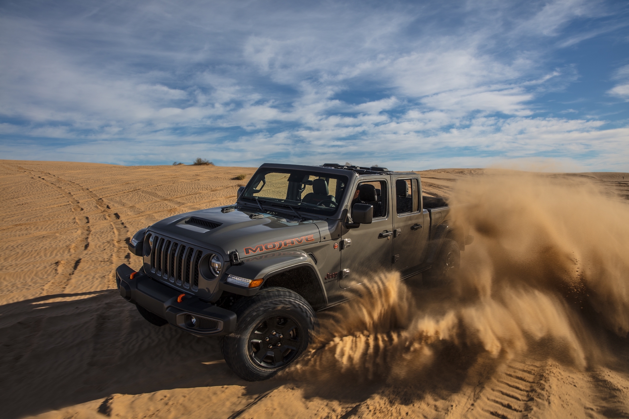2020 Jeep Gladiator Mojave front three-quarter on desert sand action