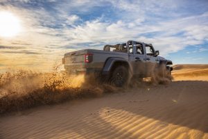 2020 Jeep Gladiator Mojave rear three-quarter on desert sand action