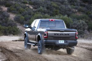 2020 Ram Power Wagon Crew Cab rear three-quarter action on dirt road