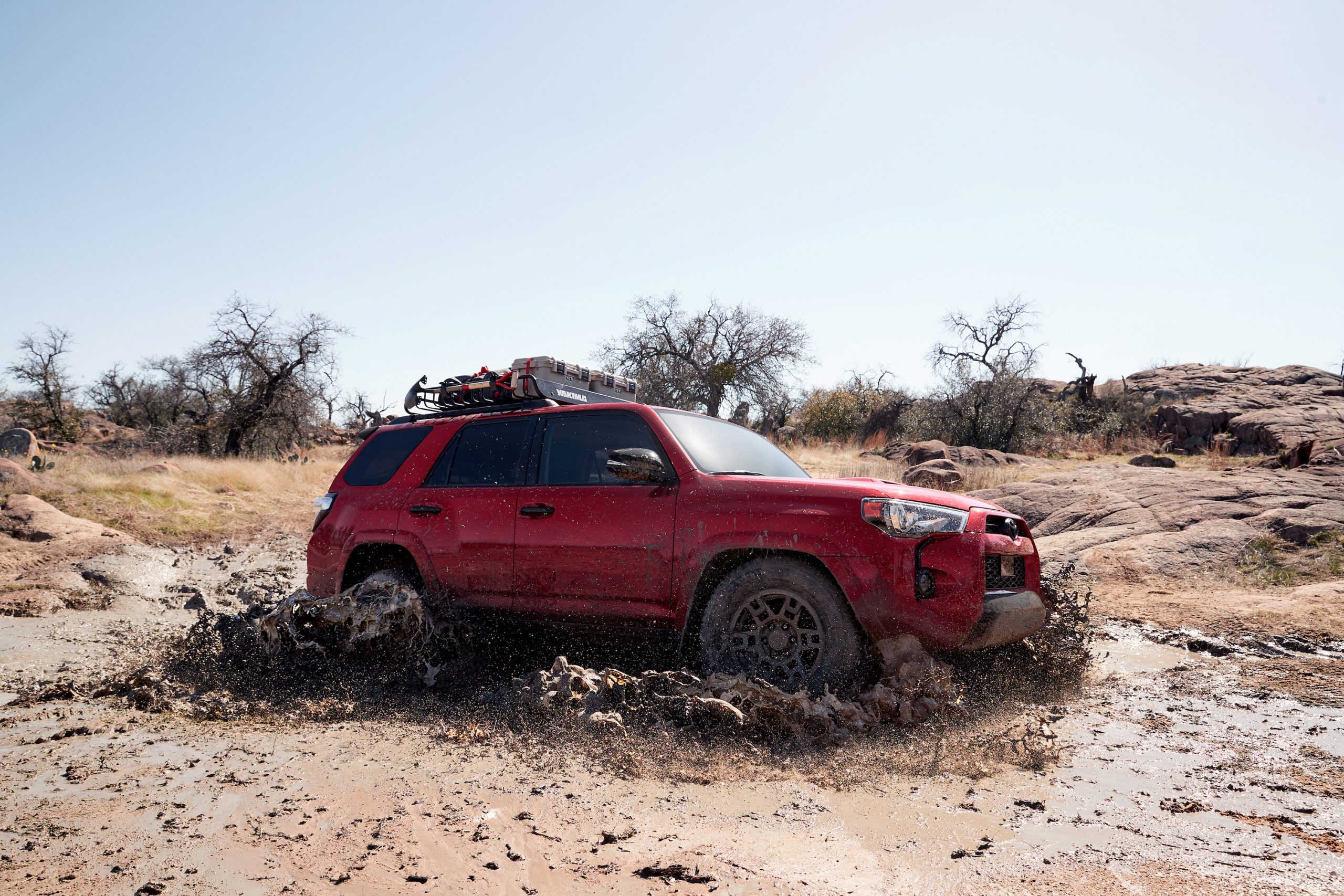 2020 Toyota 4Runner Venture Edition front three-quarter in mud action
