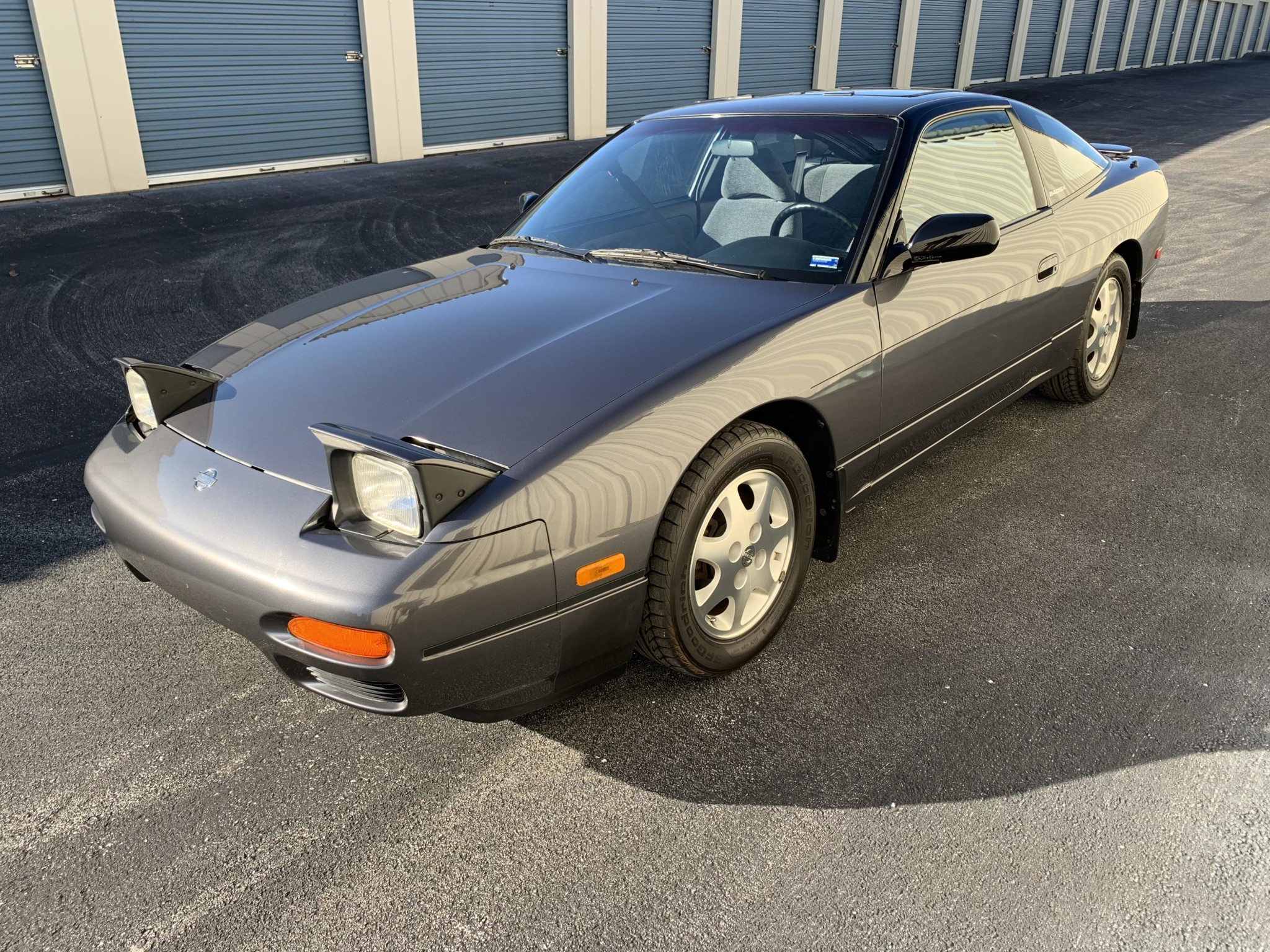 1993 Nissan 240SX S13 front three-quarter in Charcoal Metallic